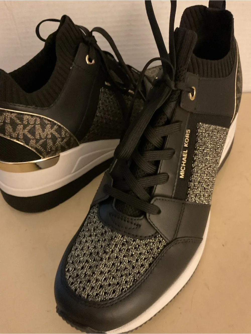 Michael Kors women black leather gold knit MK logo platform Georgie sneakers 11